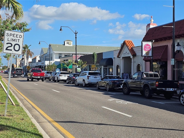 23503 Waverly Cir, Venice, FL 34293 - view of asphalt road featuring street lights, curbs, and a residential view