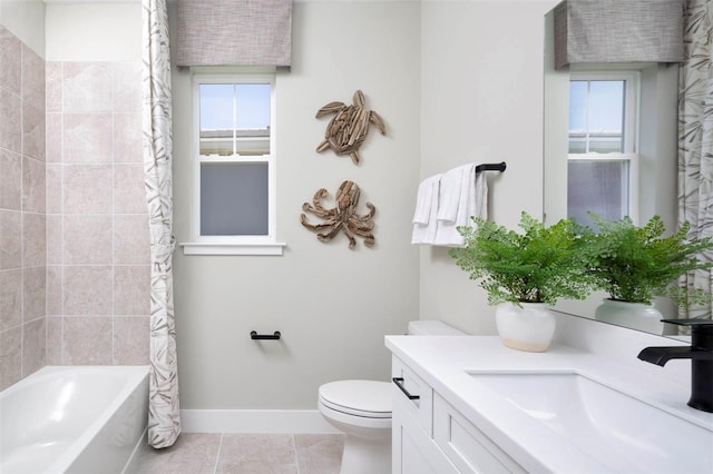 full bathroom with tile patterned floors, shower / bath combo with shower curtain, vanity, and toilet