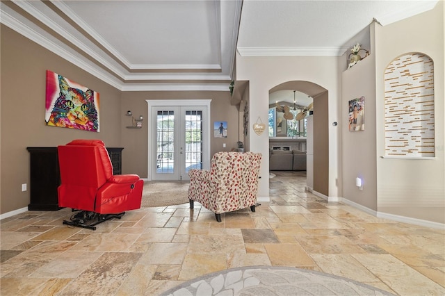 living area with french doors and crown molding