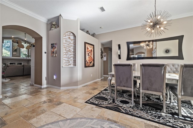 dining space featuring crown molding and a notable chandelier