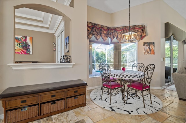 dining area with a chandelier, crown molding, and a healthy amount of sunlight