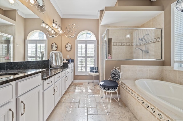 bathroom featuring plus walk in shower, vanity, and ornamental molding