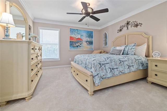 carpeted bedroom featuring ceiling fan and ornamental molding