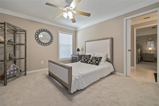 carpeted bedroom with ceiling fan and ornamental molding