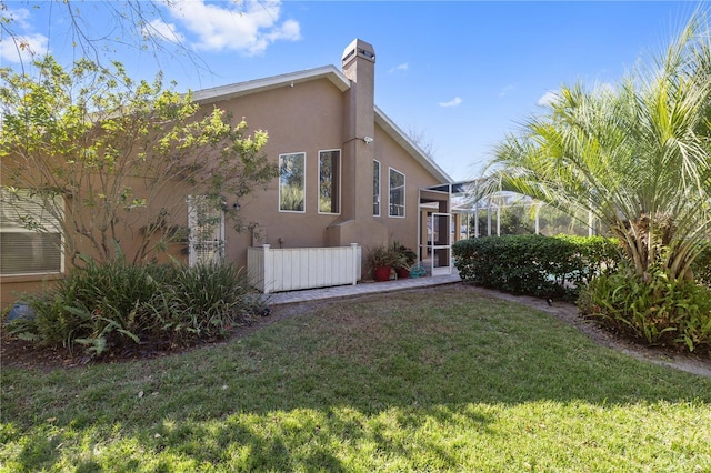 view of home's exterior with a lawn