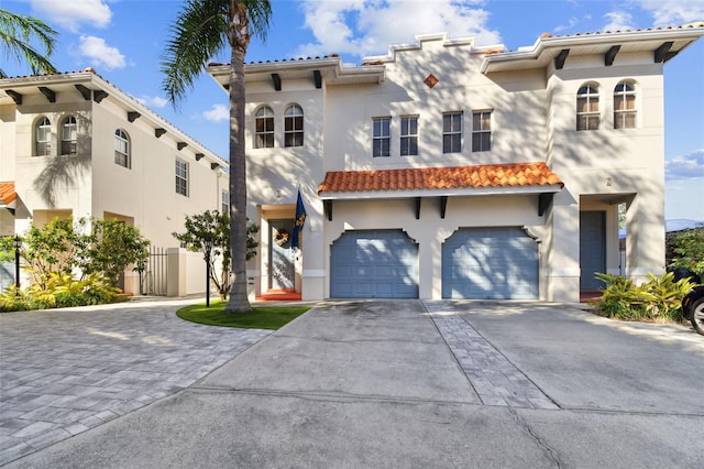 mediterranean / spanish-style home with a garage