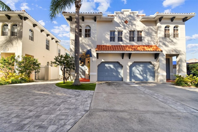 mediterranean / spanish house with a garage