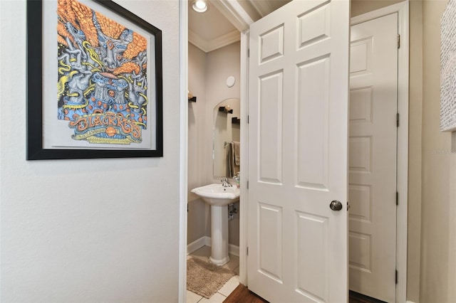 bathroom with crown molding