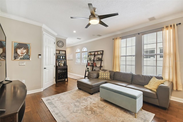 living room featuring ornamental molding, ceiling fan, a textured ceiling, and dark hardwood / wood-style flooring