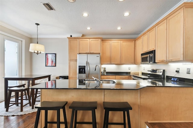 kitchen with crown molding, appliances with stainless steel finishes, sink, and light brown cabinetry