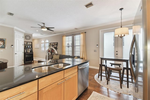 kitchen featuring sink, hanging light fixtures, stainless steel appliances, crown molding, and light brown cabinets