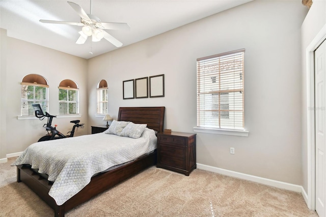 carpeted bedroom with ceiling fan