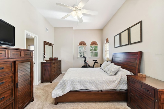 bedroom featuring ceiling fan and light colored carpet