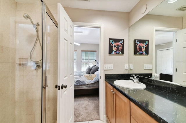 bathroom with an enclosed shower and vanity