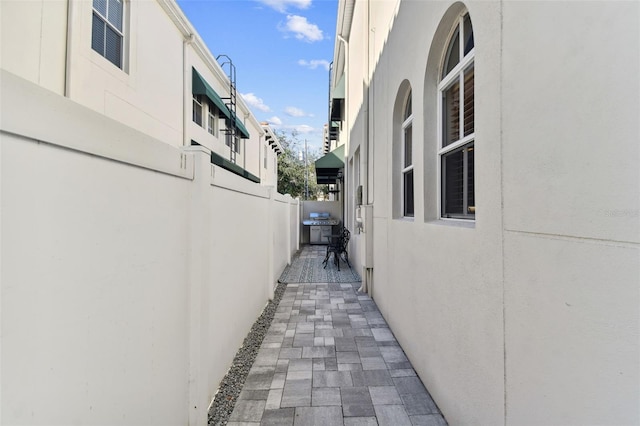 view of property exterior featuring a patio area