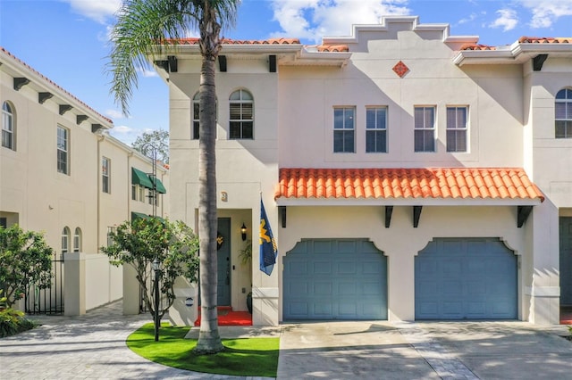 mediterranean / spanish-style home featuring a garage