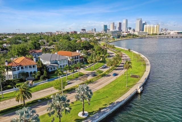 birds eye view of property with a water view