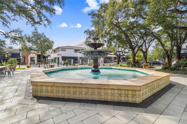 view of pool with pool water feature