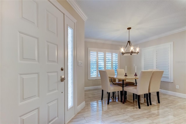 dining space featuring crown molding and a chandelier