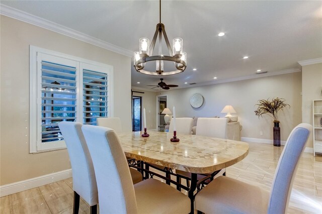 dining area with ceiling fan with notable chandelier, light hardwood / wood-style floors, and ornamental molding