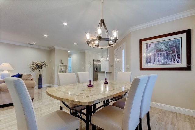 dining room featuring a chandelier and crown molding