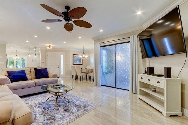 living room featuring a wealth of natural light, ceiling fan with notable chandelier, and ornamental molding