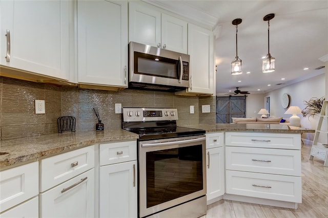 kitchen with white cabinets, hanging light fixtures, ceiling fan, appliances with stainless steel finishes, and tasteful backsplash