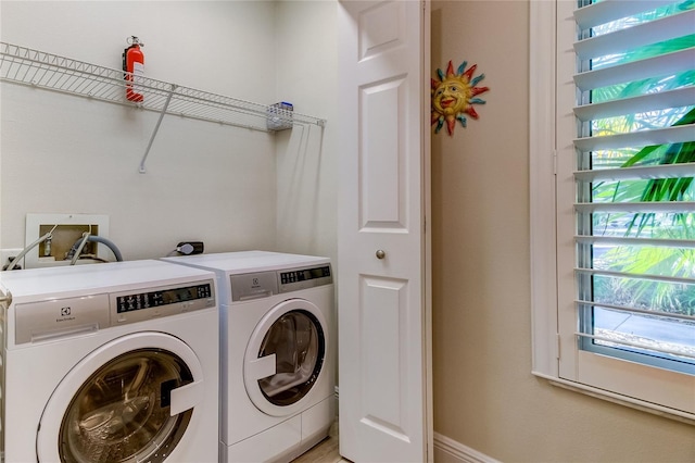 laundry area featuring washing machine and dryer