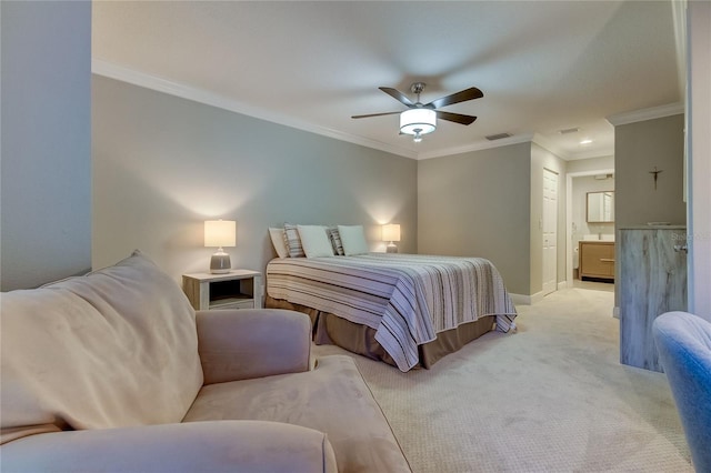 carpeted bedroom featuring a closet, ensuite bathroom, ceiling fan, and crown molding