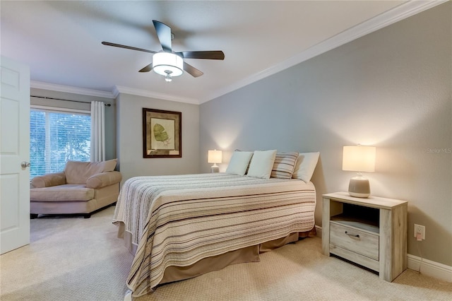 carpeted bedroom featuring ceiling fan and crown molding