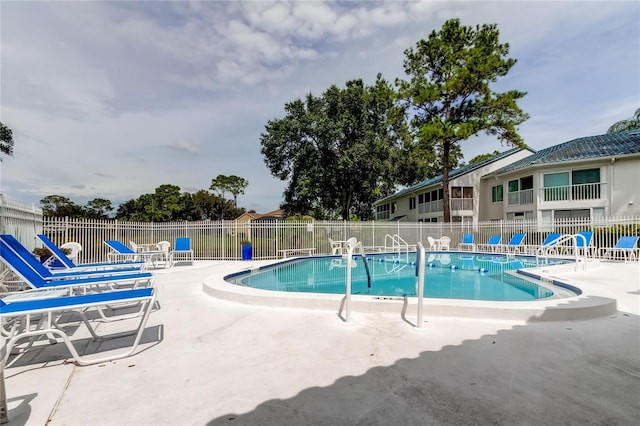 view of pool featuring a patio