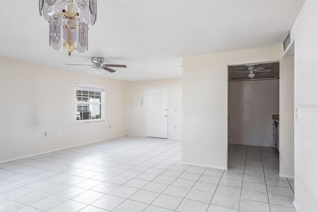 unfurnished bedroom featuring ceiling fan, light tile patterned floors, a textured ceiling, and a closet