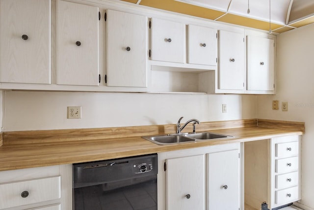 kitchen featuring sink, white cabinets, and black dishwasher