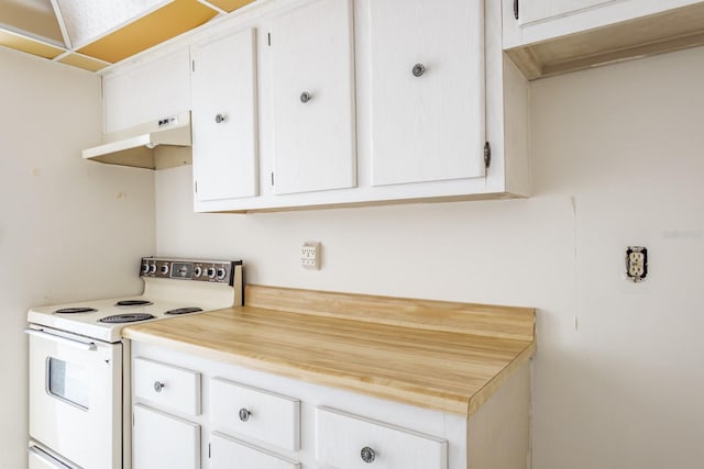 kitchen featuring white range with electric stovetop and white cabinets