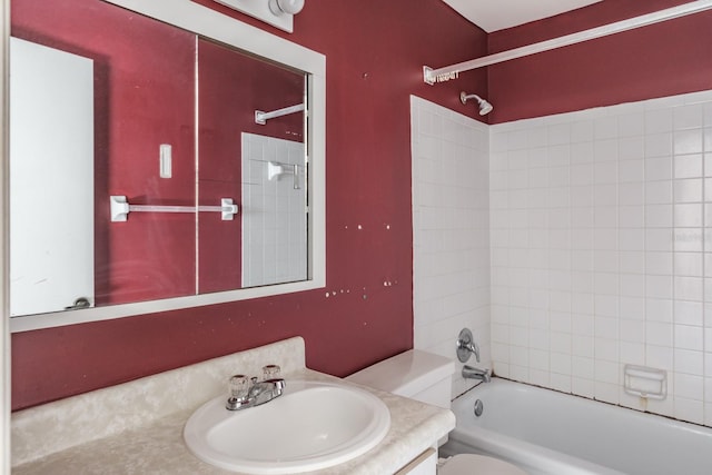 full bathroom with tiled shower / bath combo, toilet, and vanity