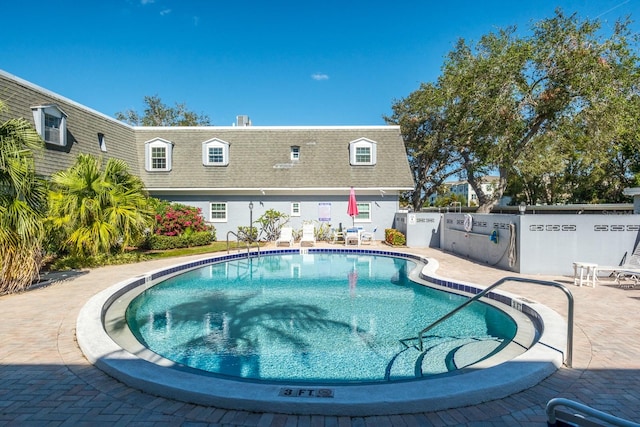 view of swimming pool featuring a patio