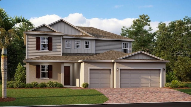 view of front facade with a front yard and a garage