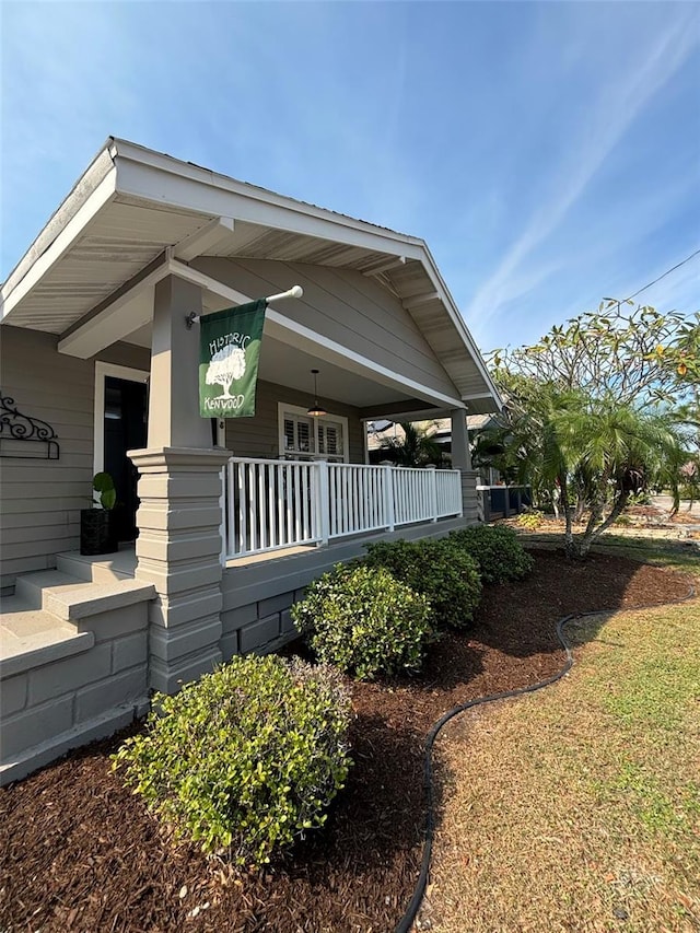 view of side of property featuring a porch