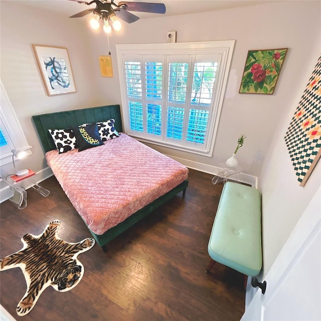 bedroom featuring ceiling fan and dark wood-type flooring