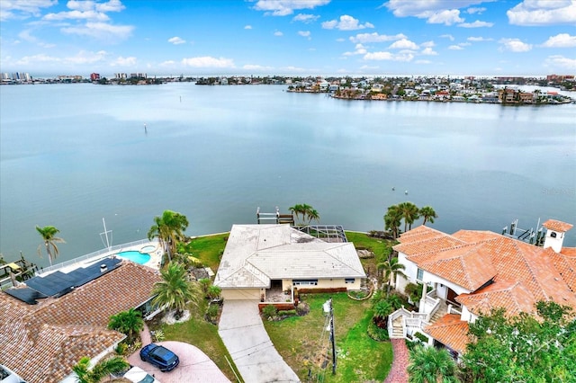 birds eye view of property with a water view