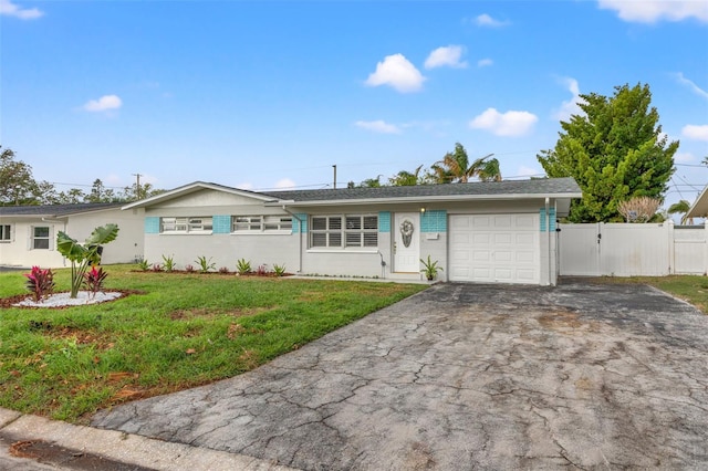 single story home with a front yard and a garage