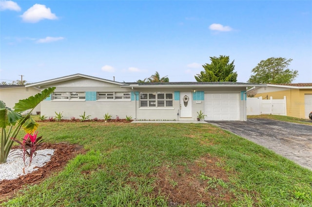 ranch-style house with a front lawn and a garage