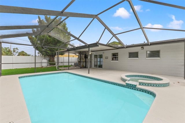 view of swimming pool featuring a lanai, an in ground hot tub, and a patio