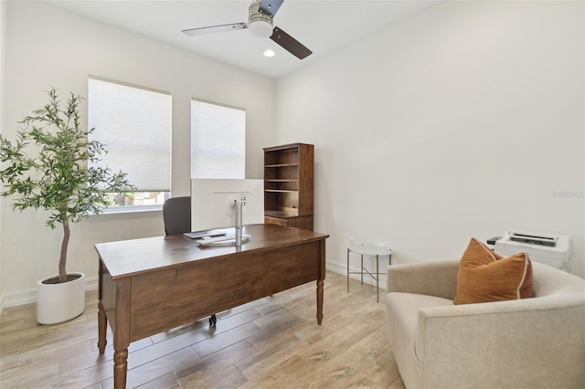 office space featuring ceiling fan and light hardwood / wood-style floors