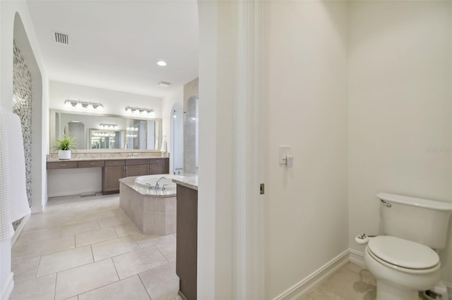 full bathroom with toilet, vanity, tile patterned flooring, and separate shower and tub