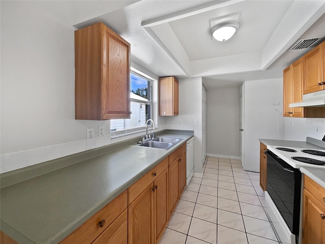 kitchen with light tile patterned floors, white appliances, a raised ceiling, and sink