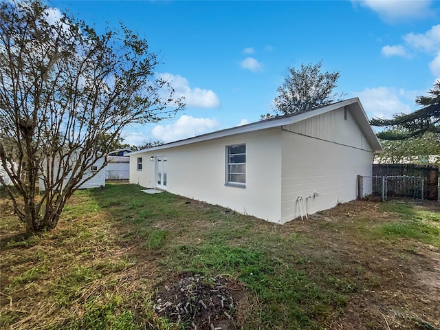 view of property exterior featuring a yard