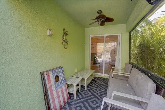 sunroom featuring ceiling fan and a healthy amount of sunlight