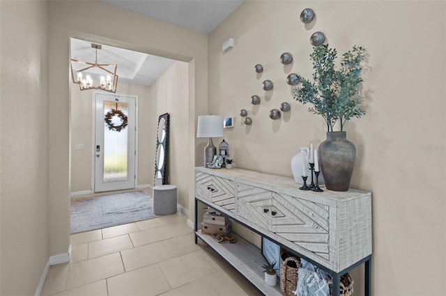 foyer featuring a notable chandelier and light tile patterned floors