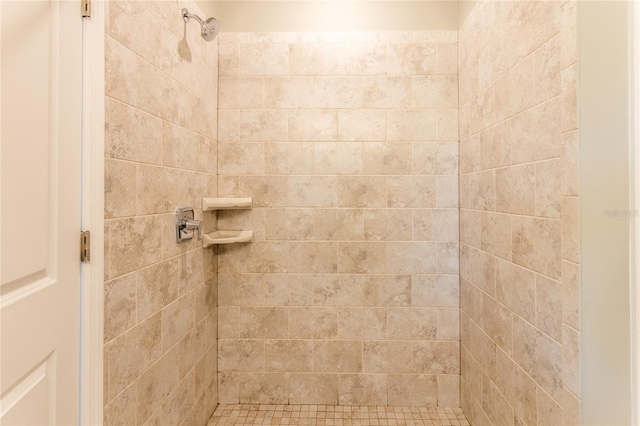 bathroom with tiled shower